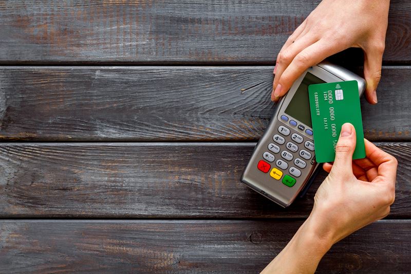 Green Debit Card being used